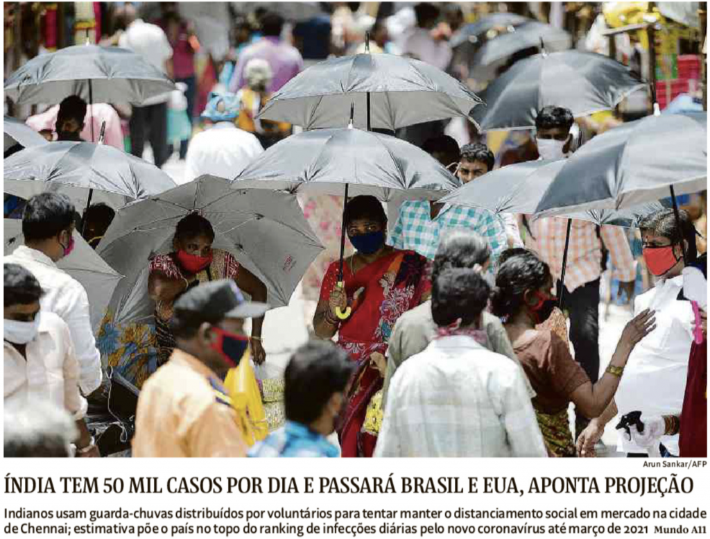 Indianos usam guarda-chuvas para manter o distanciamento social (Folha).